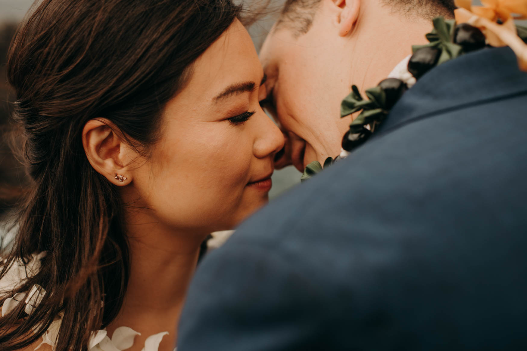 A close-up of Andrew and Alison just about to kiss. Their eyes closed.